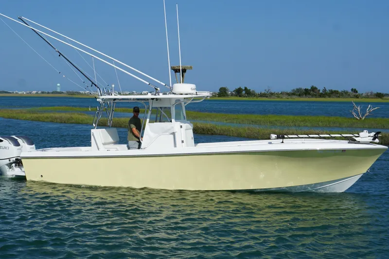 Slide: The Image of 2025 Competition 31 boat cruising on a sunny day in a scenic waterway. - 8