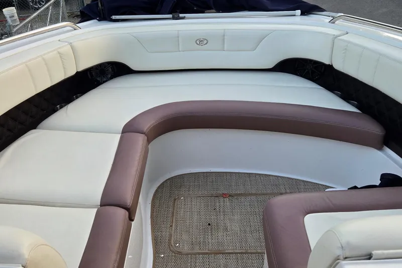 Slide: The Image of Interior seating of a 2013 Cobalt 296 boat with white and brown upholstery. - 5