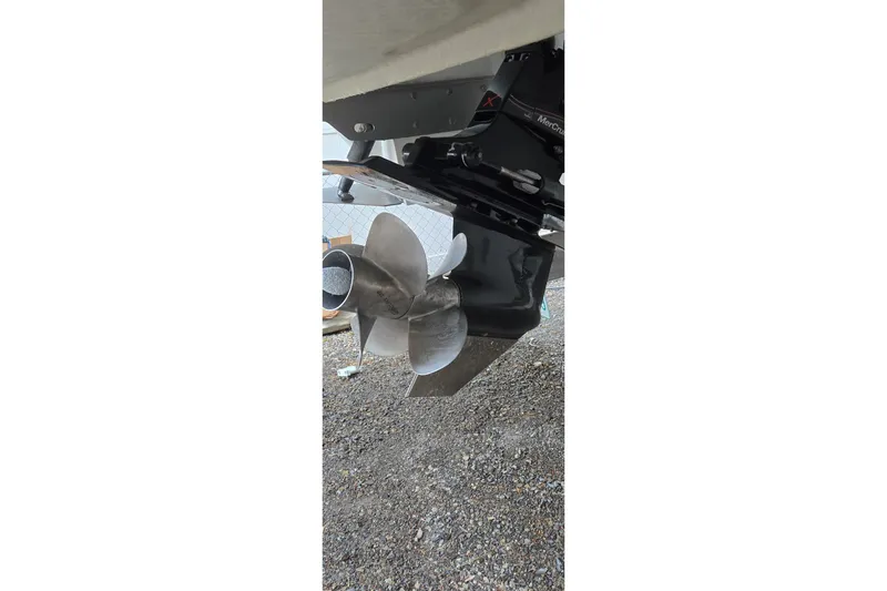 Slide: The Image of Propeller of a 2013 Cobalt 296 boat on gravel surface. - 7