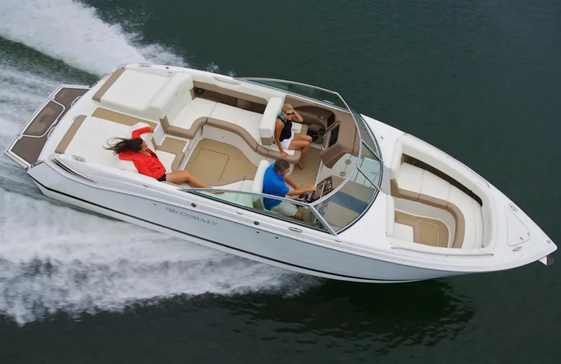 Slide: The Image of Manufacturer Provided Image: 2013 Cobalt 296 boat cruising on water with passengers. - 9