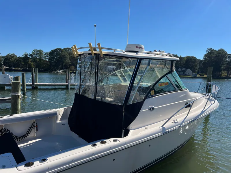 Slide: The Image of A 2008 Pursuit OS 285 Offshore docked in a calm marina. - 30