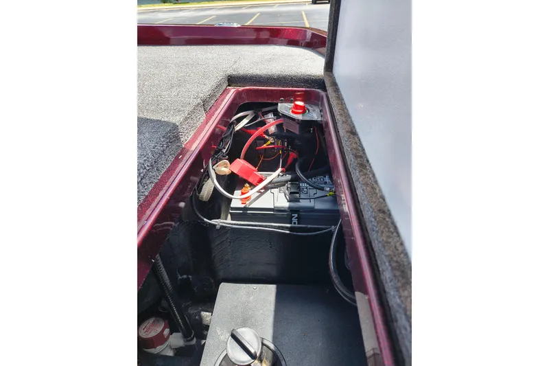 Slide: The Image of 2022 Ranger Z518 boat battery compartment with wiring and components visible. - 13