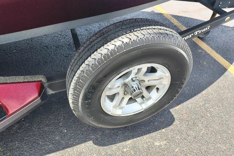 Slide: The Image of 2022 Ranger Z518 trailer tire and wheel on asphalt parking lot. - 9