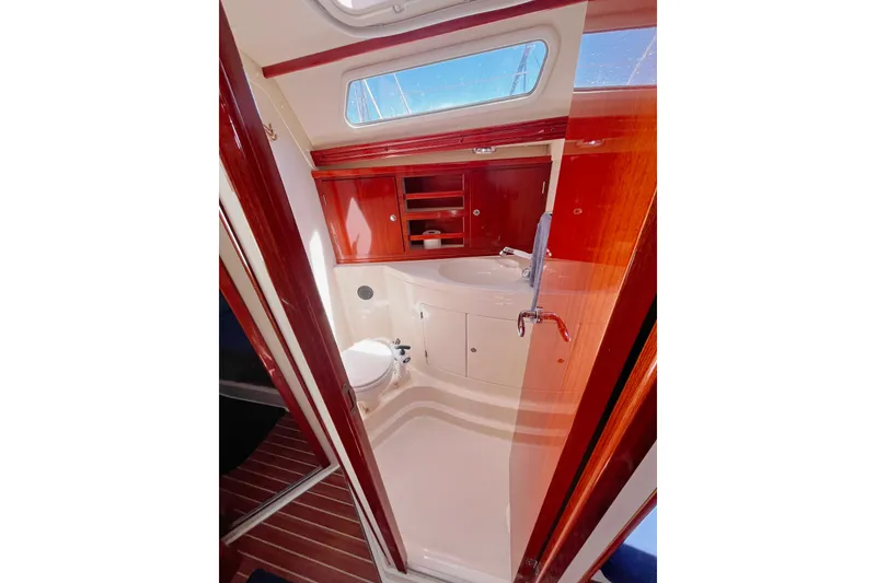 Slide: The Image of Luxurious bathroom interior of 2004 Hanse 411 yacht with wooden cabinetry and modern fixtures. - 10