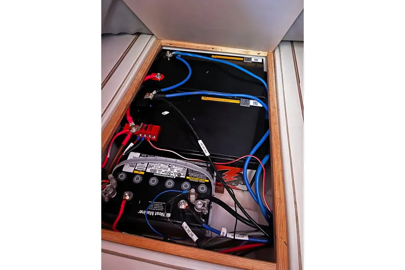 Slide: The Image of Electrical wiring and battery setup in a 2004 Hanse 411 sailboat. - 13