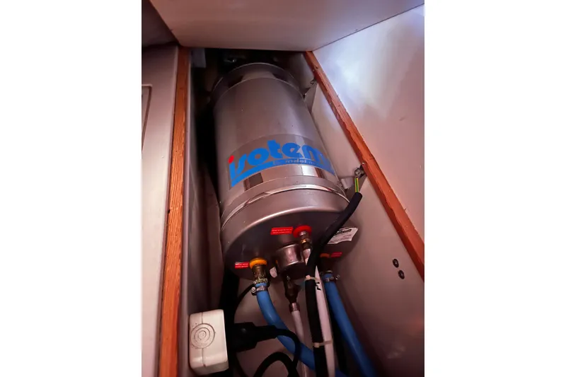 Slide: The Image of Water heater installation in 2004 Hanse 411 yacht interior compartment. - 14