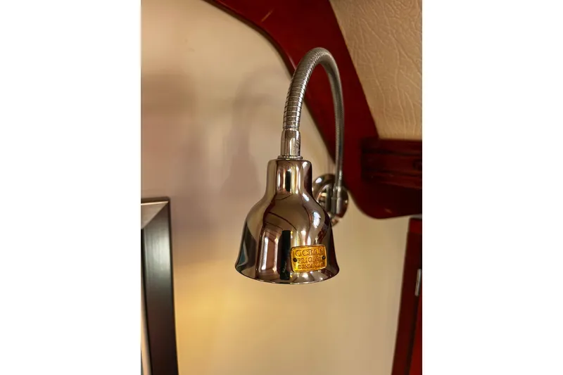 Slide: The Image of Chrome reading light fixture on a 2004 Hanse 411 yacht interior. - 15