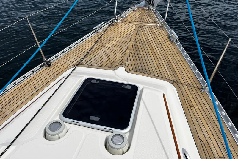 Slide: The Image of Deck of 2004 Hanse 411 sailboat with wooden finish and ocean view. - 17