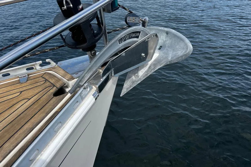 Slide: The Image of Bow of 2004 Hanse 411 yacht with anchor over calm water. - 19