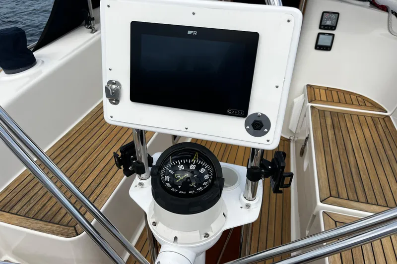 Slide: The Image of Cockpit of 2004 Hanse 411 sailboat with compass and navigation display. - 29