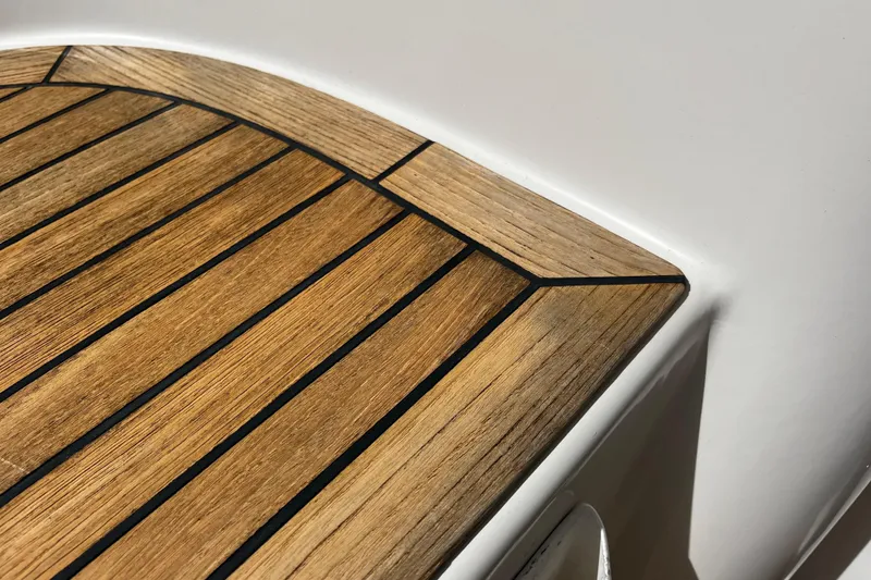 Slide: The Image of Teak deck detail on 2004 Hanse 411 yacht, showcasing elegant wood craftsmanship. - 34