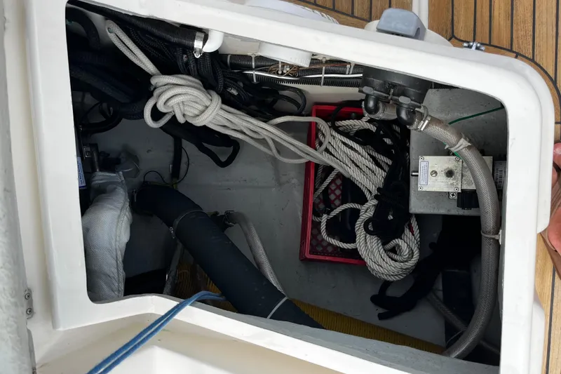 Slide: The Image of Storage compartment on a 2004 Hanse 411 sailboat with ropes and equipment. - 37