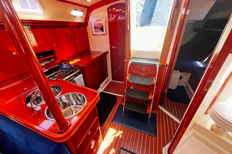 Slide: The Image of Luxurious 2004 Hanse 411 yacht interior with polished wood finish and modern amenities. - 7