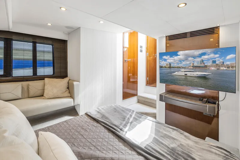 Slide: The Image of Luxurious interior of a 2013 Princess V57 yacht with TV and sofa. - 19
