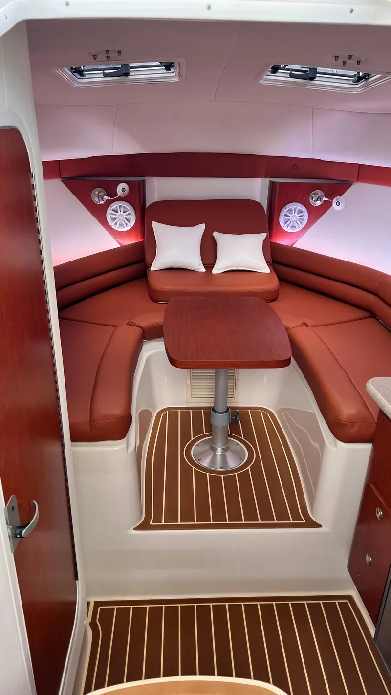 Slide: The Image of Interior of a Pro-Line 32 Express with red upholstery and wood flooring. - 17