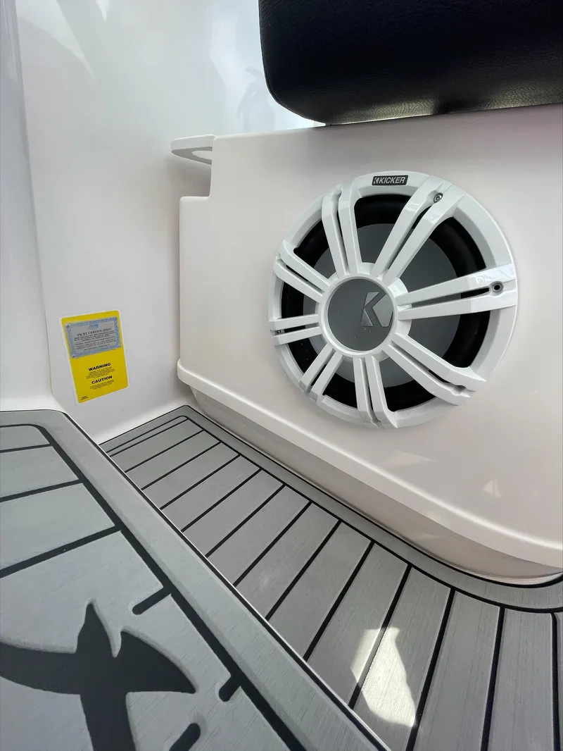 Slide: The Image of Close-up of a speaker on a boat with gray flooring. - 22