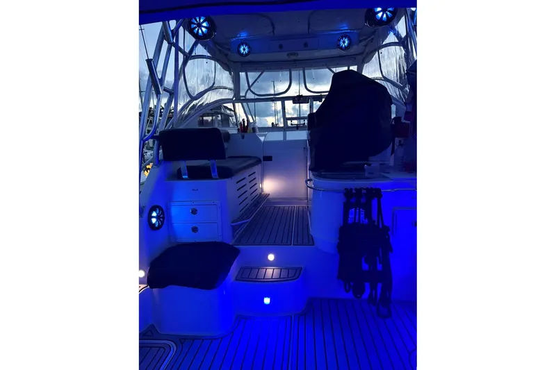 Slide: The Image of Interior of 2006 Pro-Line 32 Express boat with blue ambient lighting. - 31