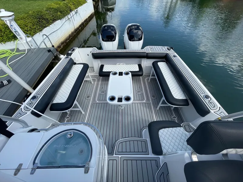 Slide: The Image of The boat features a spacious seating area with a central table. - 6
