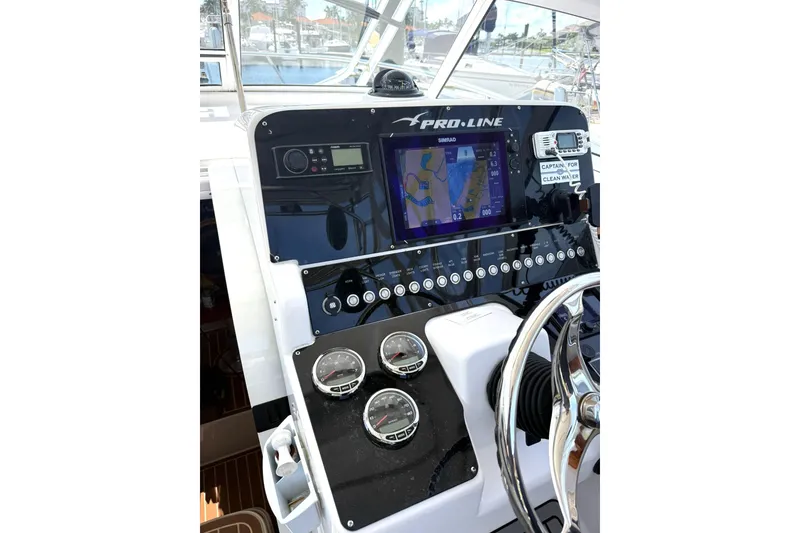 Slide: The Image of Dashboard of 2006 Pro-Line 32 Express boat with navigation and control instruments. - 9