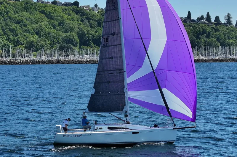 Slide: The Image of 2018 J Boats J/97E sailing with vibrant purple spinnaker on a sunny day. - 1