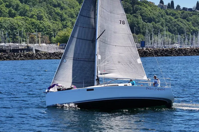 Slide: The Image of 2018 J Boats J/97E sailboat cruising on a sunny day near a marina. - 7