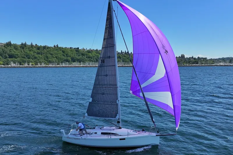 Slide: The Image of 2018 J Boats J/97E sailing with vibrant purple spinnaker on a sunny day. - 6