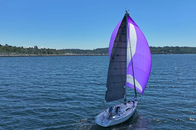 Slide: The Image of 2018 J Boats J/97E sailing with vibrant purple spinnaker on a sunny day. - 4