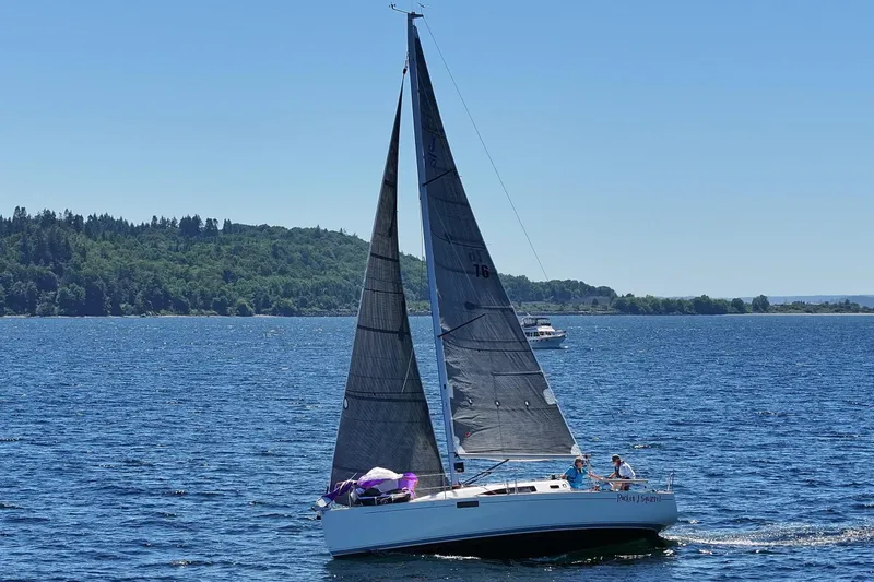Slide: The Image of 2018 J Boats J/97E sailing on a sunny day with lush green shoreline. - 5