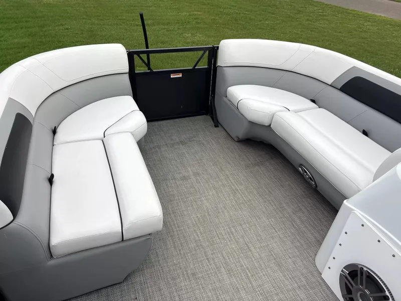 Slide: The Image of Interior of a Viaggio L20C pontoon boat with white and gray seating. - 4