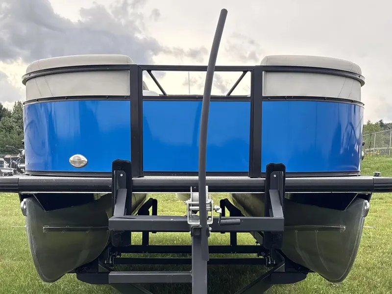 Slide: The Image of A blue Viaggio pontoon boat, model L20C, year 2021, is on a trailer. - 2
