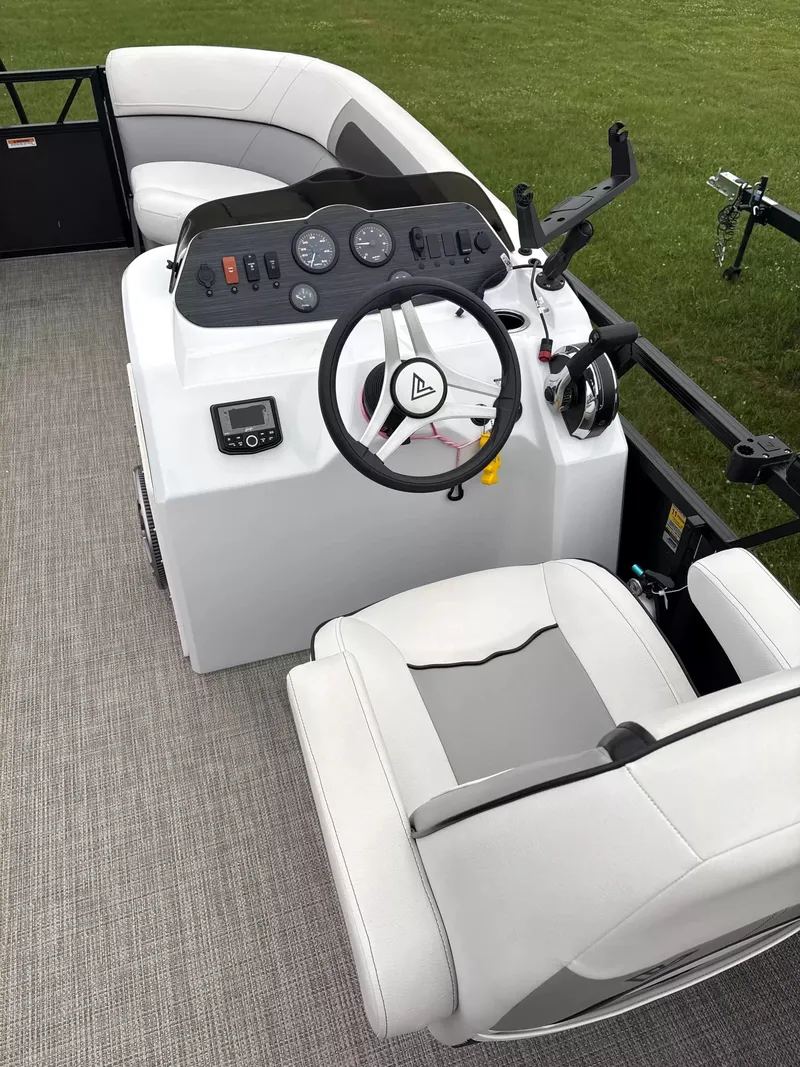 Slide: The Image of The image shows the cockpit of a 2021 Viaggio L20C boat with a modern helm. - 6