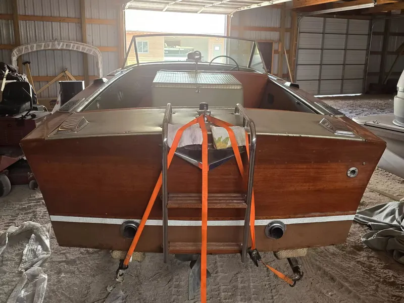 Slide: The Image of A 1966 Century 17 Resorter in a storage shed, featuring wooden paneling and orange straps. - 3