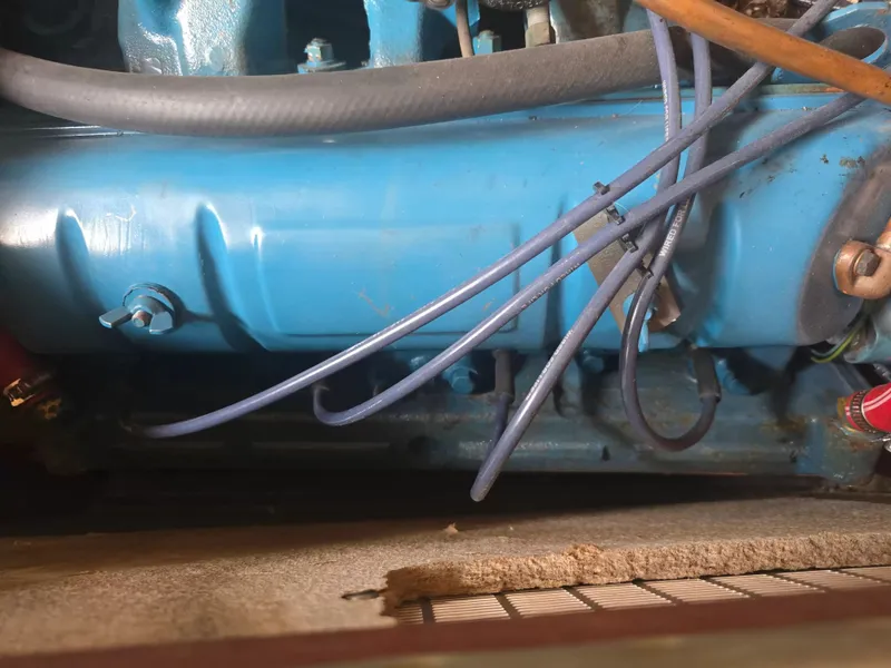 Slide: The Image of Close-up of a blue boat engine with cables and hoses. - 8