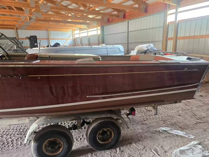 Slide: The Image of A 1966 Century 17 Resorter is on a trailer inside a warehouse. - 2