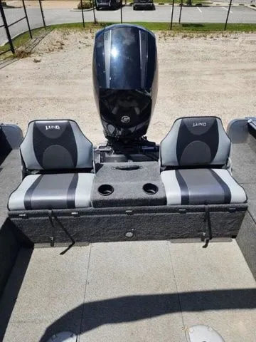 Slide: The Image of 2014 Lund Impact 1875 boat with two seats and motor. - 2