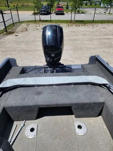 Slide: The Image of 2014 Lund Impact 1875 boat parked on gravel. - 3