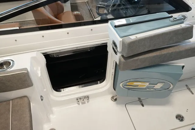 Slide: The Image of The image shows the cockpit of a Sea Hunt Ultra 265SE with seating and storage. - 21