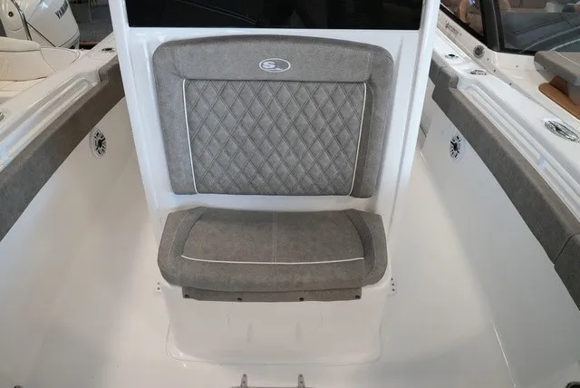 Slide: The Image of The 2027 Sea Hunt Ultra 265SE features a cushioned seat with a quilted pattern. - 42