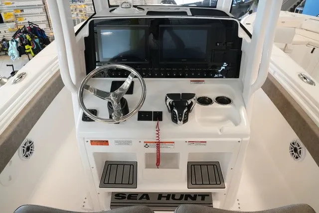 Slide: The Image of Helm of the Sea Hunt Ultra 265SE with modern instruments and steering wheel. - 34