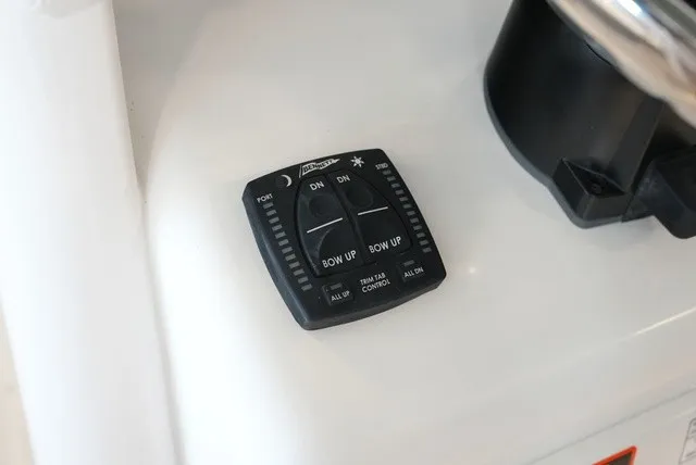 Slide: The Image of Trim tab control on a boat. - 39