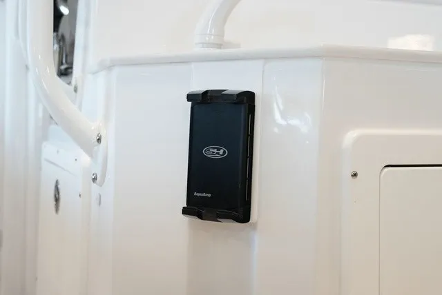 Slide: The Image of Close-up of a white boat section with a black device mounted on the wall. - 18