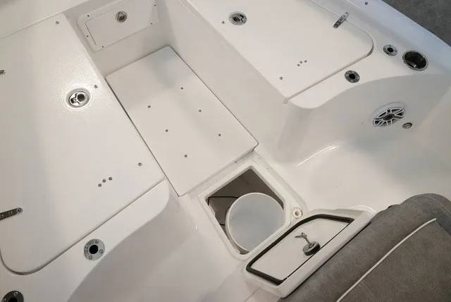 Slide: The Image of The image shows the cockpit of a Sea Hunt Ultra 265SE boat with storage and a speaker. - 45