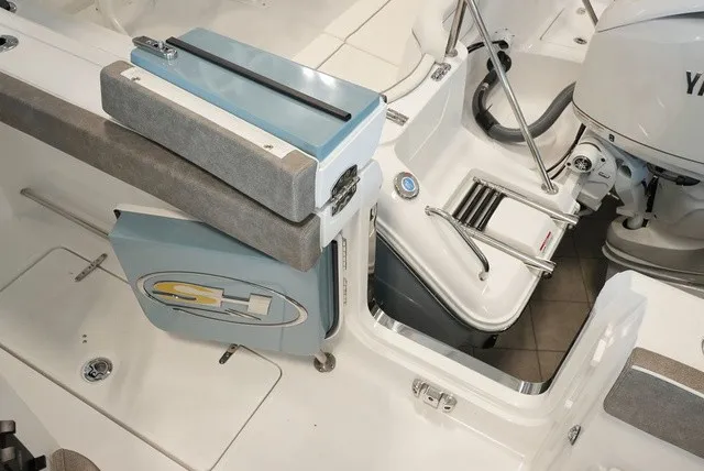 Slide: The Image of The image shows the cockpit of a Sea Hunt Ultra 265SE boat with a Yamaha engine. - 24