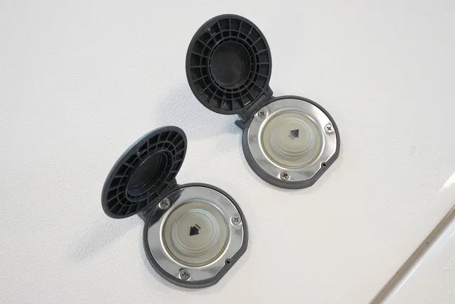 Slide: The Image of Two round, open covers on a white surface, possibly for boat accessories. - 48