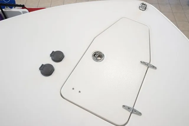 Slide: The Image of The image shows the deck of a Sea Hunt Ultra 265SE boat with hatches and fittings. - 47