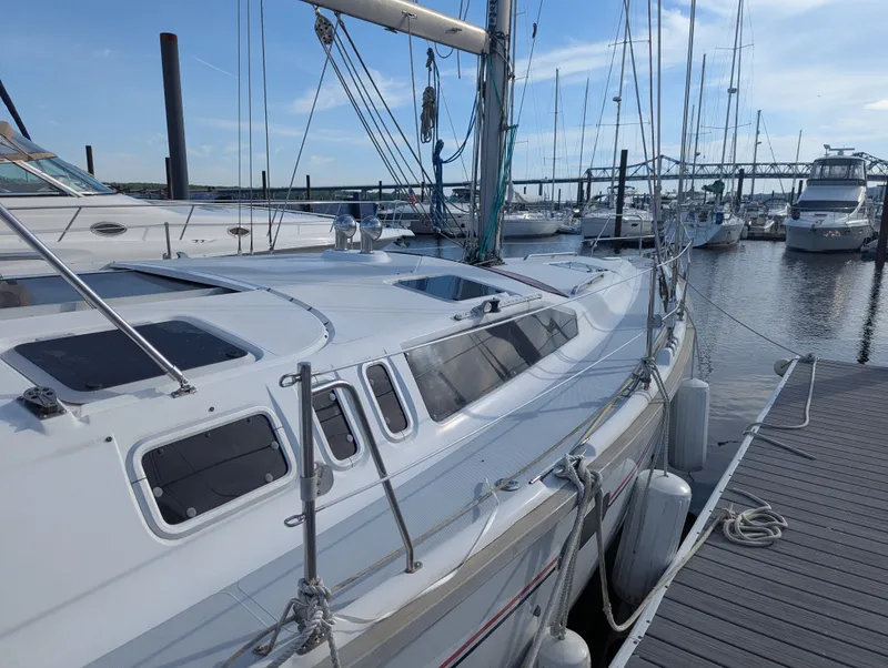 The Image of 1997 Hunter Sloop sailboat docked at marina. - 0