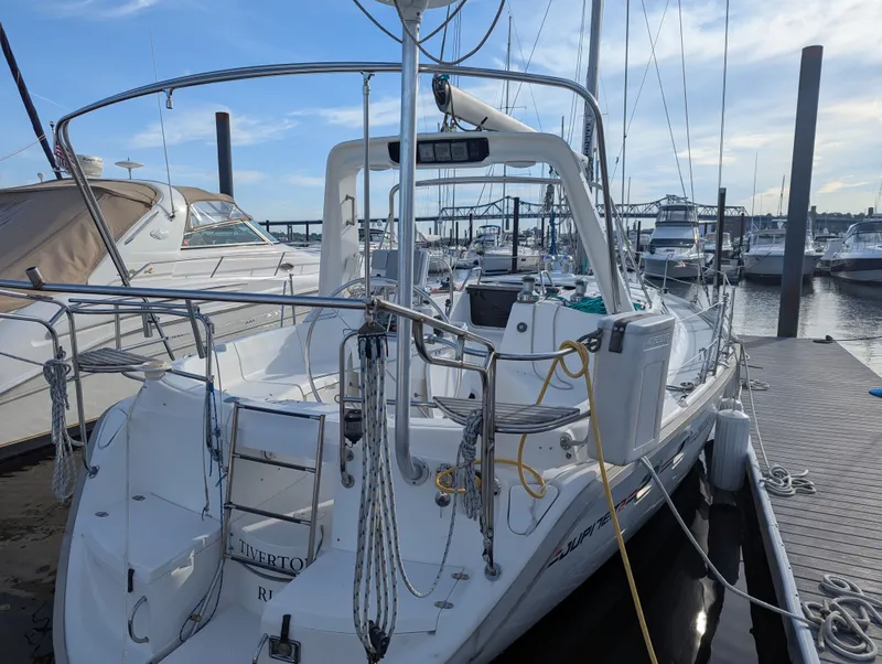 Slide: The Image of 1997 Hunter Sloop sailboat docked at marina. - 1