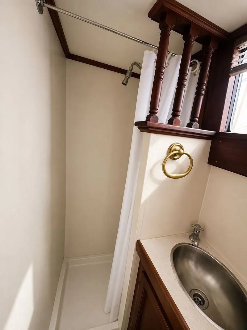 Slide: The Image of Interior of 1951 Chris-Craft 50 Catalina with shower and sink. - 14