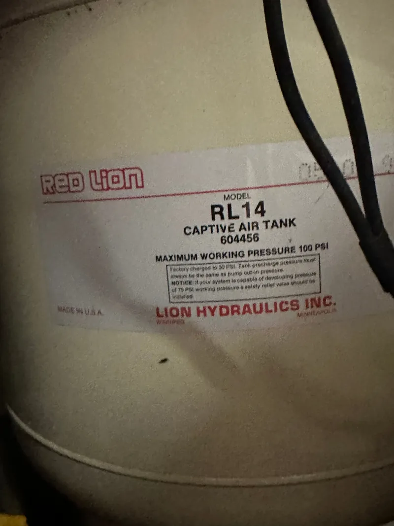 Slide: The Image of Red Lion RL14 captive air tank, maximum working pressure 100 PSI. - 32