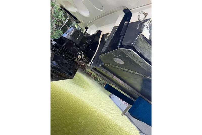 Slide: The Image of 2018 Sea Ray Sundancer 260 boat underside, showing propeller and hull details. - 18